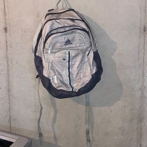 grey and blue Adidas backpack